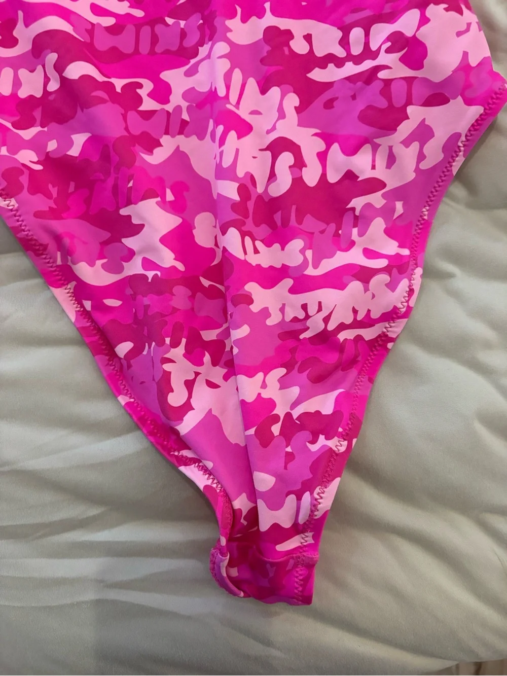 Women’s SKIMS pink camoflauge one piece bathing suit, size medium great conditio